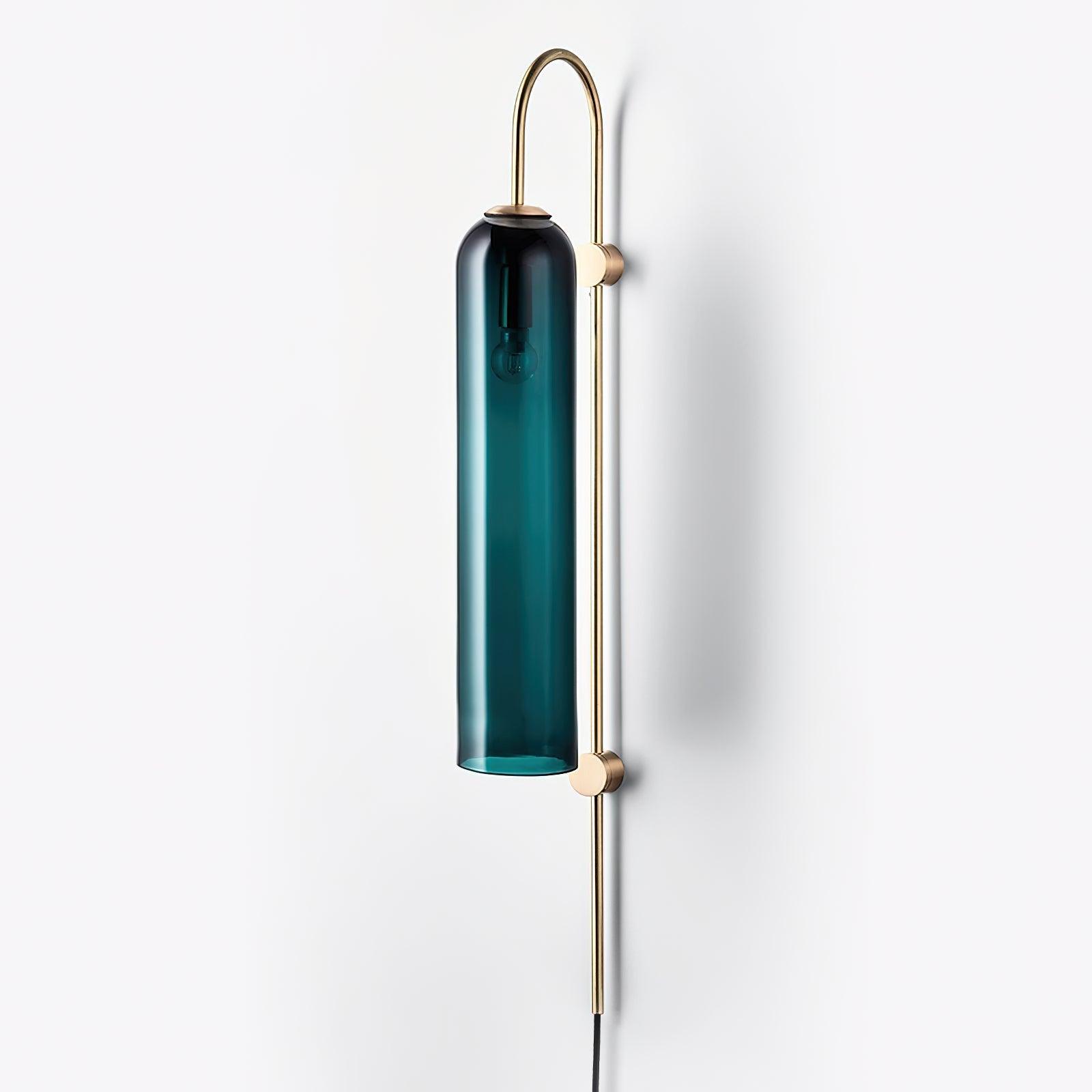 Clérachic mouth-blown glass wall sconce in teal seen three-quarter on, the bulb holder visible at the cap of the shade.