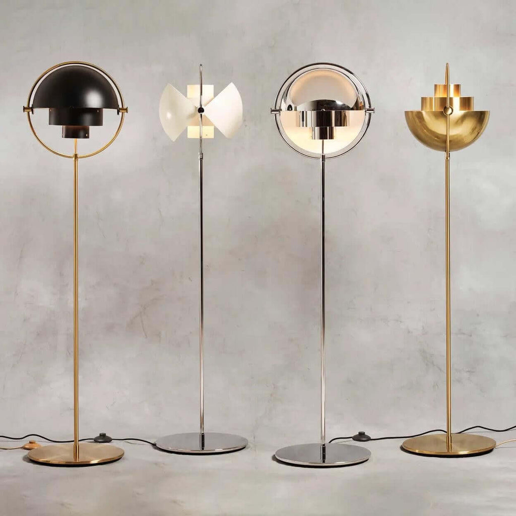 All four finishes of the Clérachic floor lamp side by side: Black & Brass, White & Chrome, Chrome and Brass.