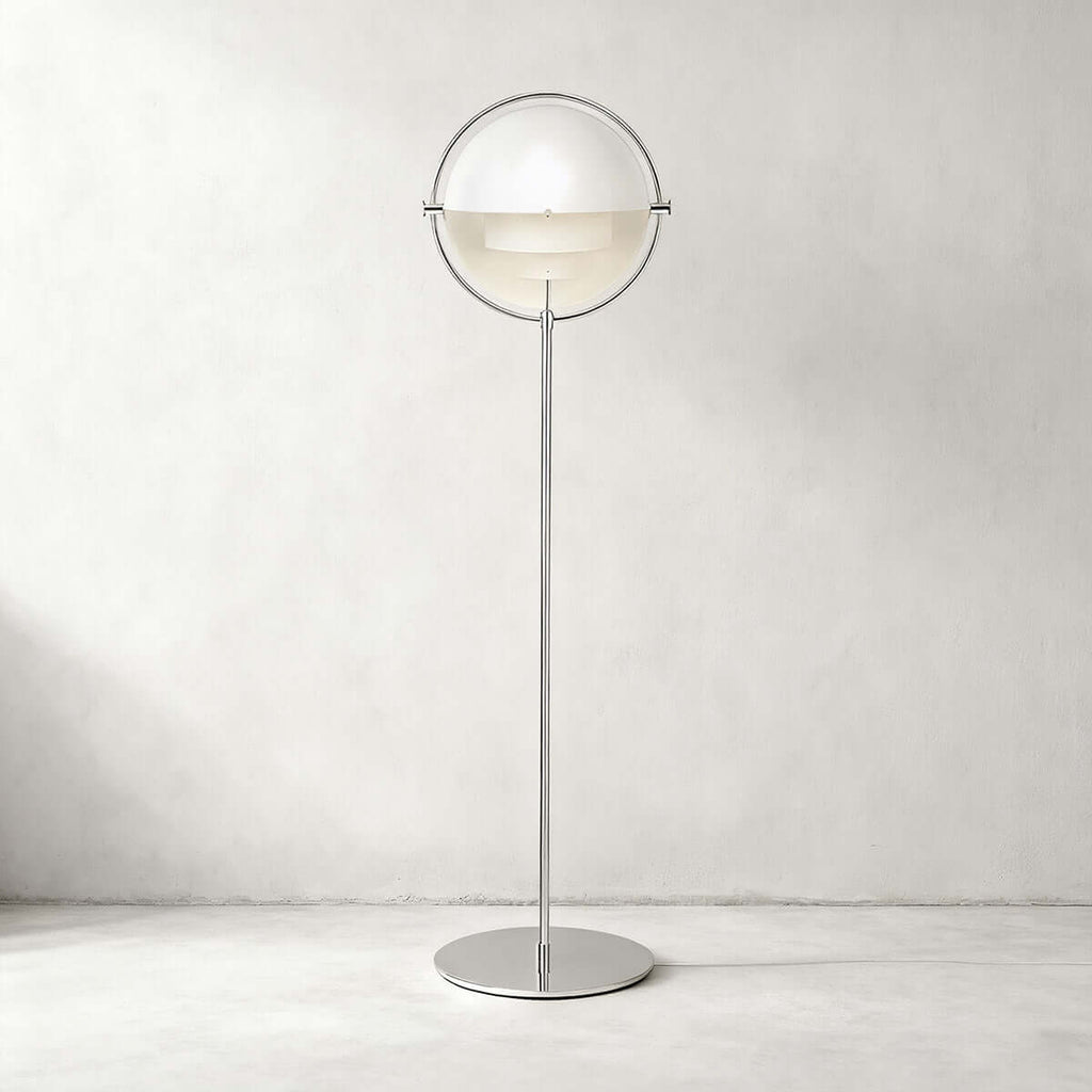 Gloss white shades and a polished chrome ring give this Clérachic floor lamp in White & Chrome a crisp look on a pale wall.