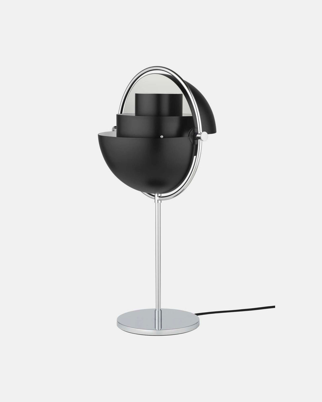 In Black & Chrome, the Clérachic table lamp has both quarter-sphere shades rotated open, letting light spread sideways as well as down.