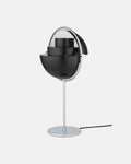 In Black & Chrome, the Clérachic table lamp has both quarter-sphere shades rotated open, letting light spread sideways as well as down.