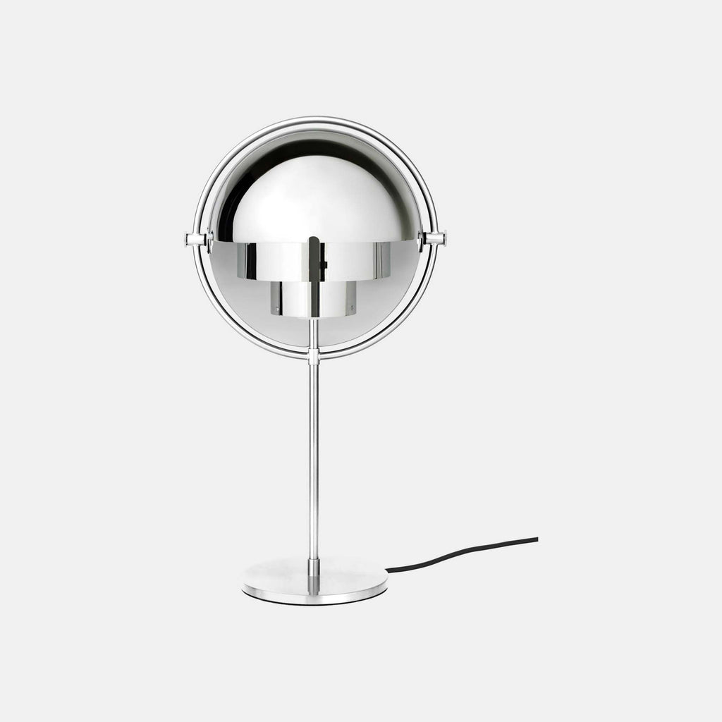 A Clérachic table lamp in Chrome, polished across shades, ring, stem and base, standing alone on a plain studio backdrop.
