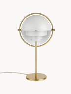 Shown closed, the Clérachic table lamp in White & Brass brings its two gloss white quarter-sphere shades together inside a brushed brass ring.