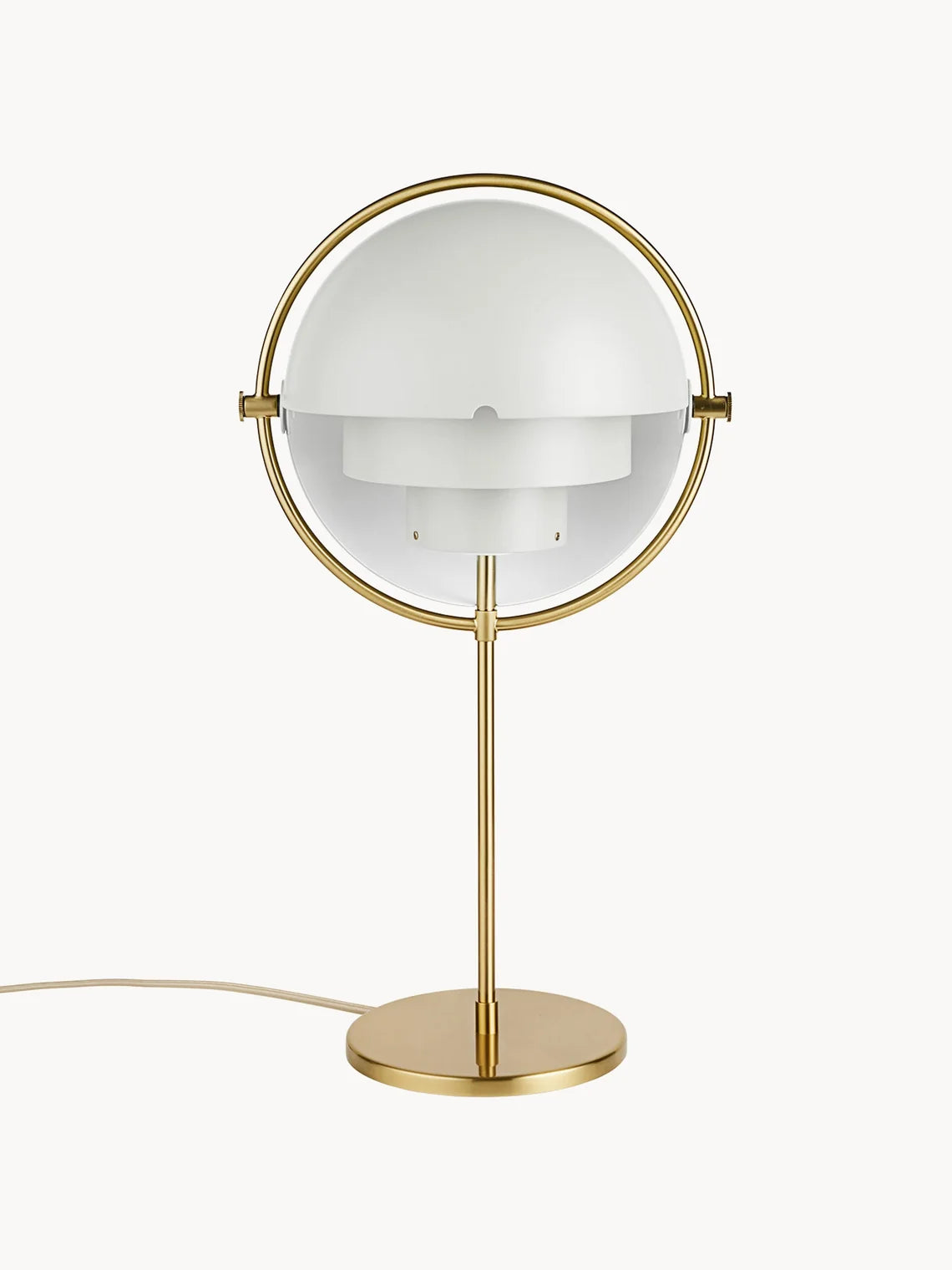 Shown closed, the Clérachic table lamp in White & Brass brings its two gloss white quarter-sphere shades together inside a brushed brass ring.