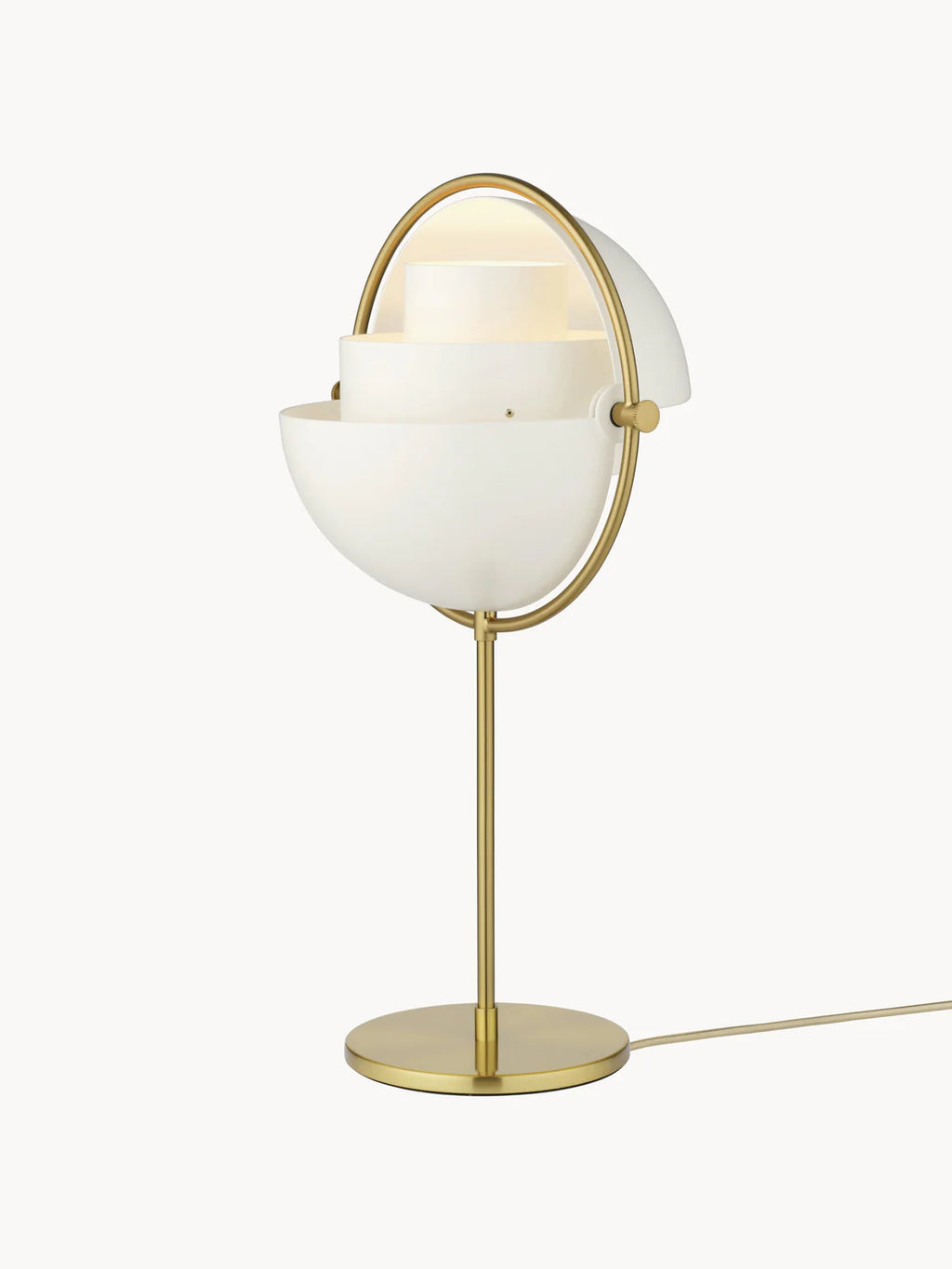Open shades on the Clérachic table lamp in White & Brass reveal the fixed inner cylinders, the setting that spreads light out into the room.
