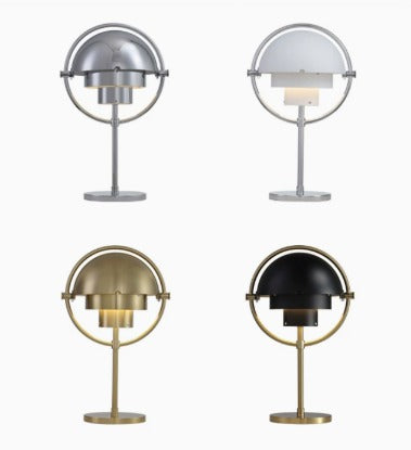 Four of the eight Clérachic finishes shown together: chrome, white with chrome, brass, and black with a brass ring.
