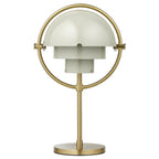 Clérachic rechargeable table lamp in soft sand with a brushed brass ring and base, shades closed into a dome.