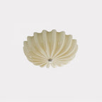 The beige version of the Clérachic Murano-Style Scalloped Glass Flush Ceiling Light, unlit, its buttery petals shown against plain grey.