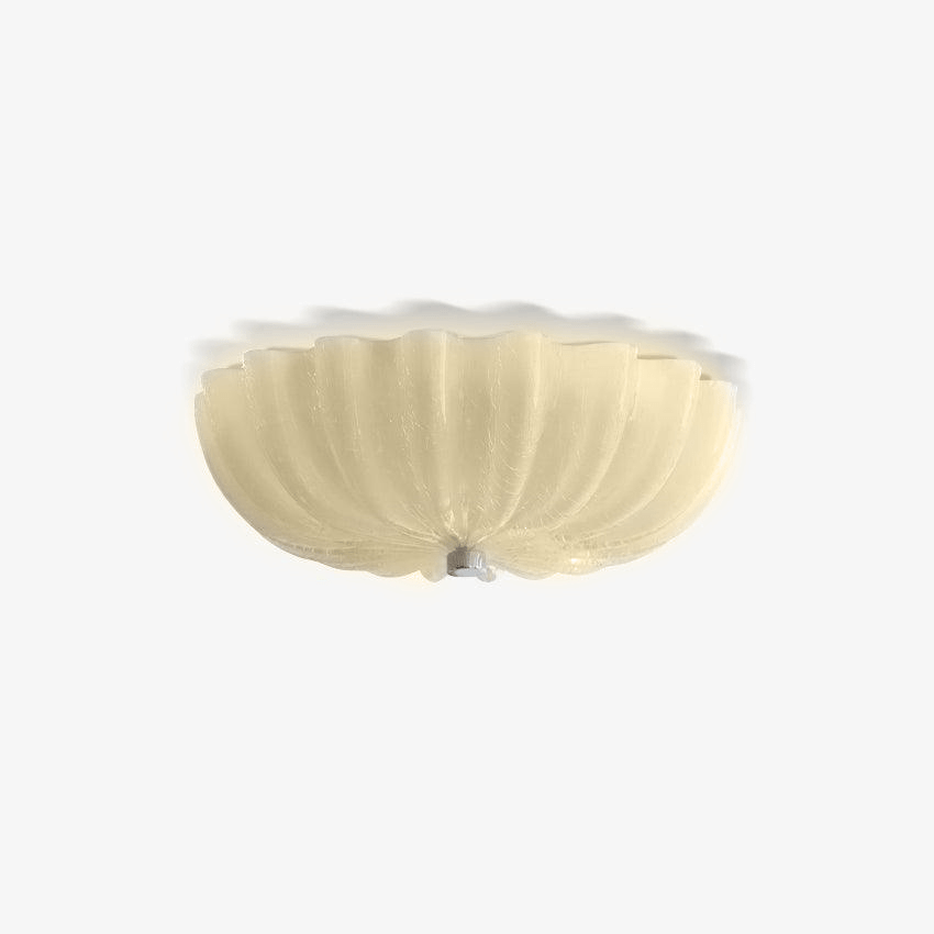 Beige craquelé glass on the Clérachic Murano-Style Scalloped Glass Flush Ceiling Light, lit to a warm honey glow flat against the ceiling.