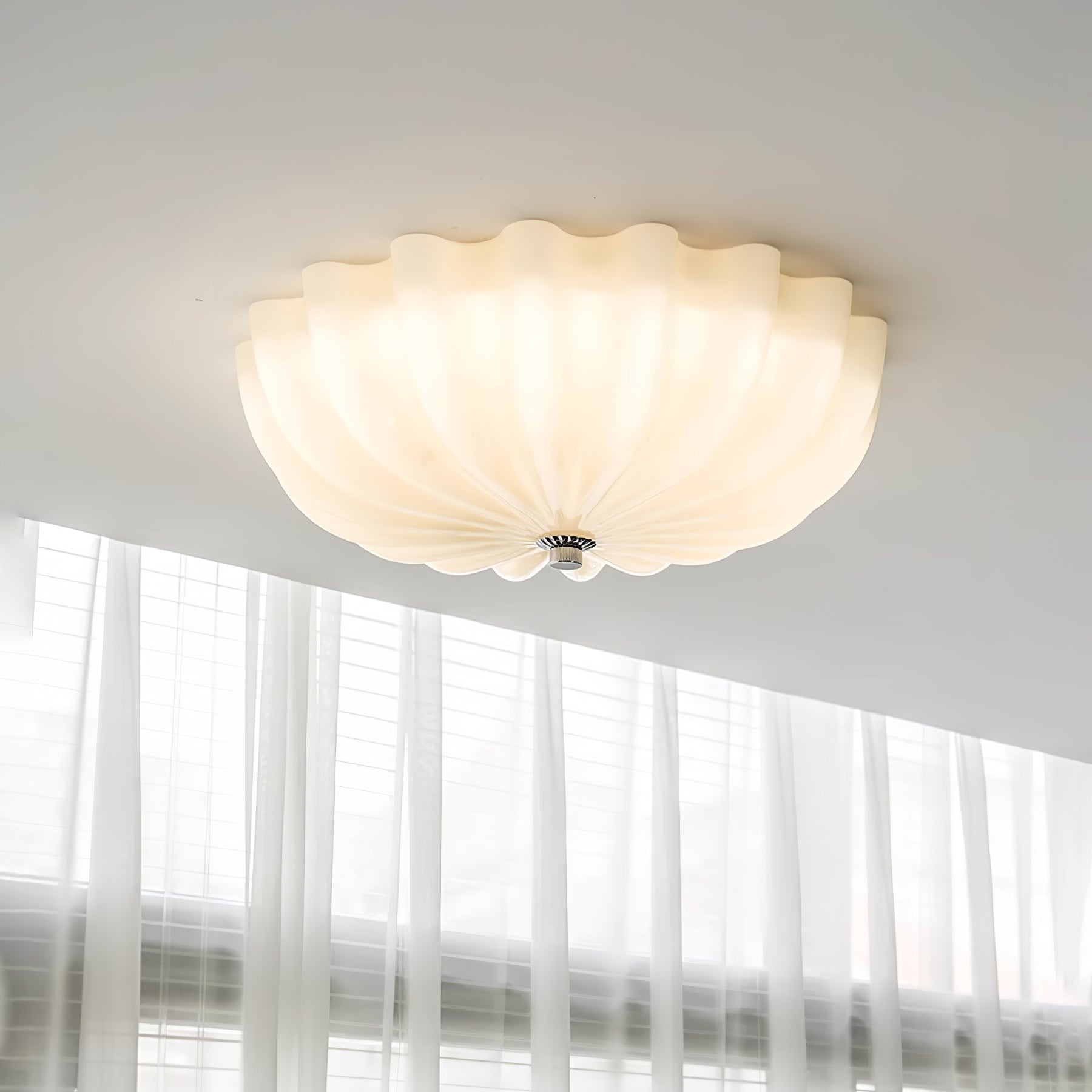 Clérachic Murano-Style Scalloped Glass Flush Ceiling Light mounted flush on a white ceiling above a bright, sheer-curtained window.