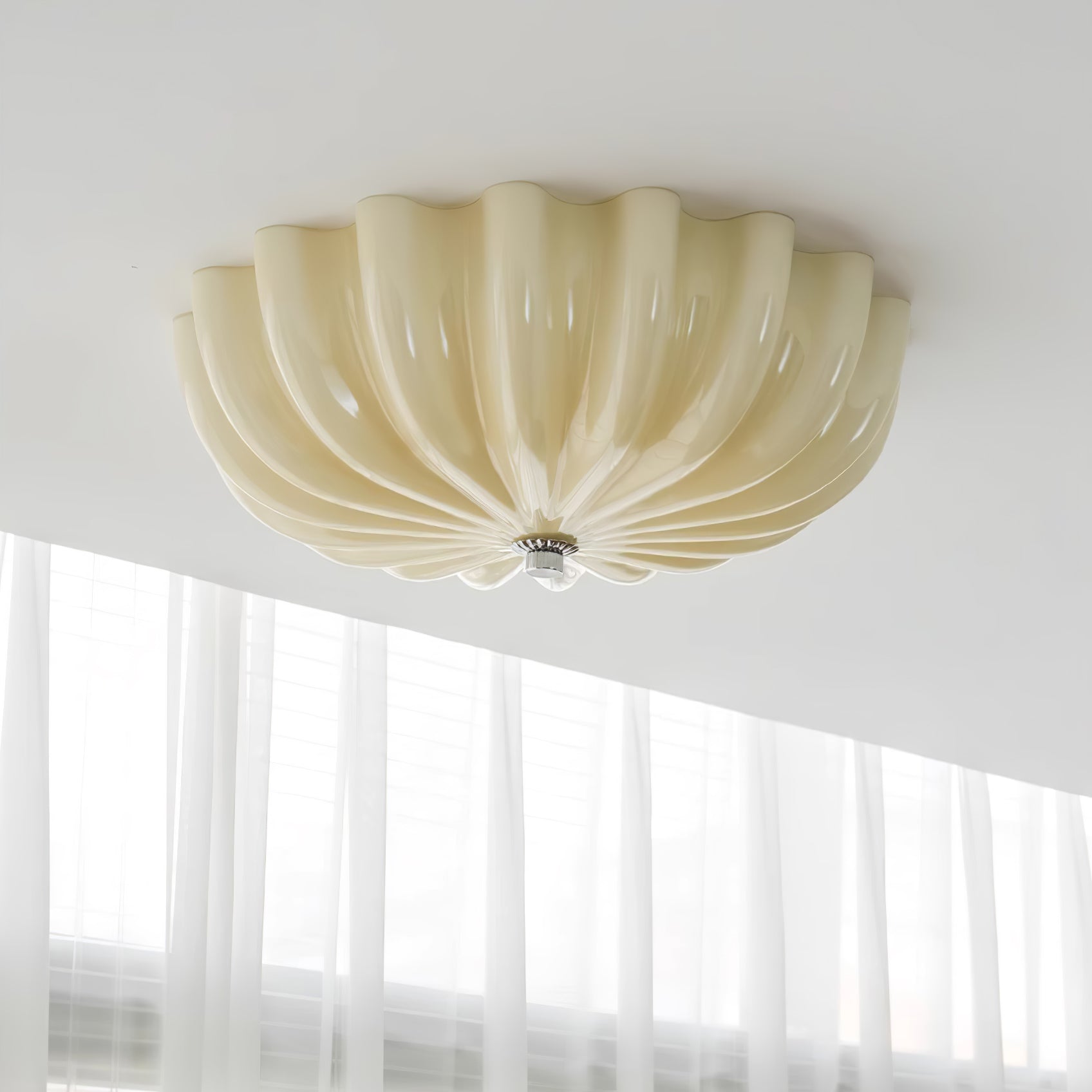 Clérachic Murano-Style Scalloped Glass Flush Ceiling Light in beige seen close up on the ceiling, petals curving to a small chrome centre.