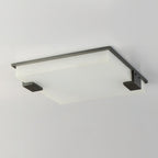 The Clérachic ceiling light photographed edge-on, revealing how shallow the panel sits against the ceiling line.