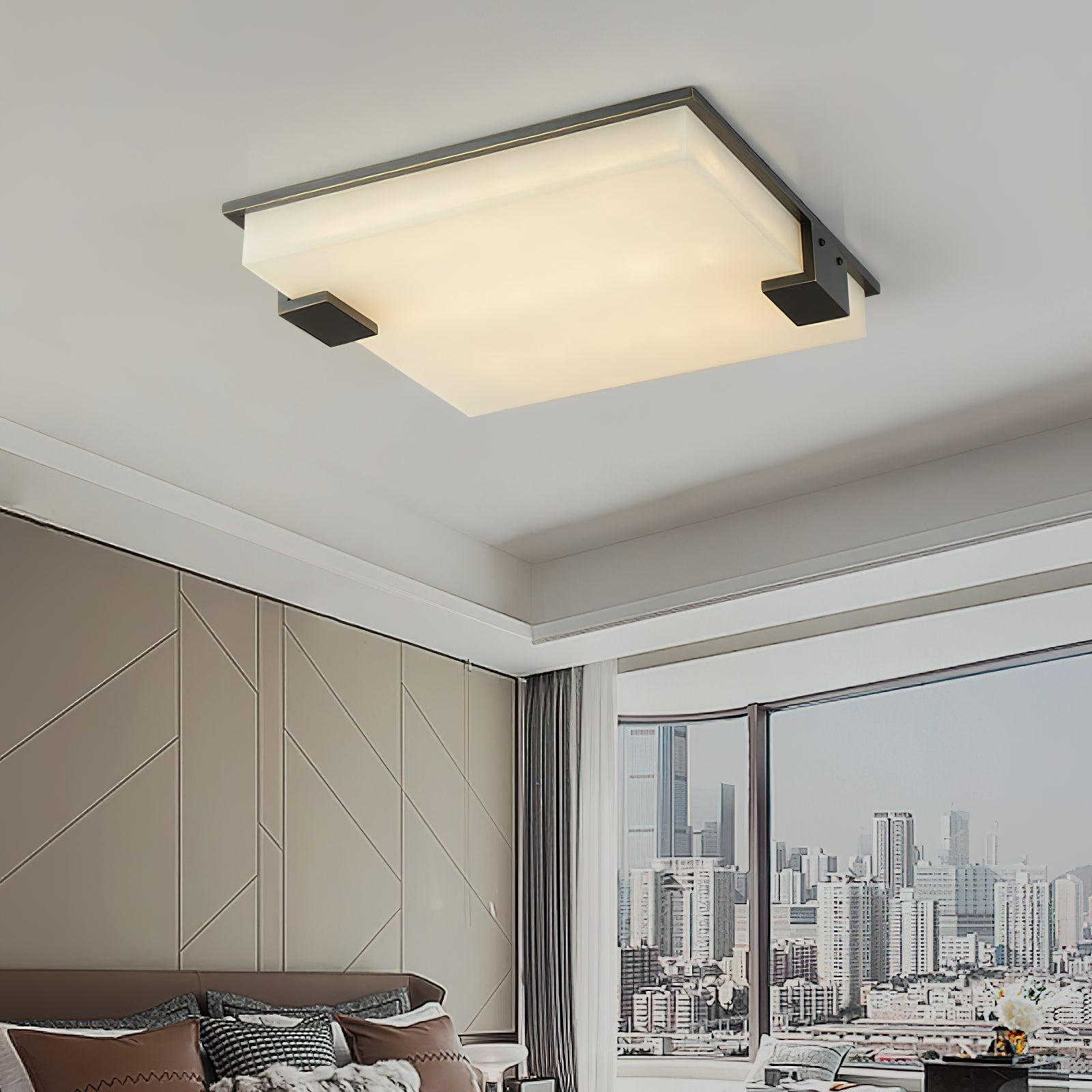 Clérachic ceiling light installed in a modern living room, casting a calm wash over the panelled wall and city window.