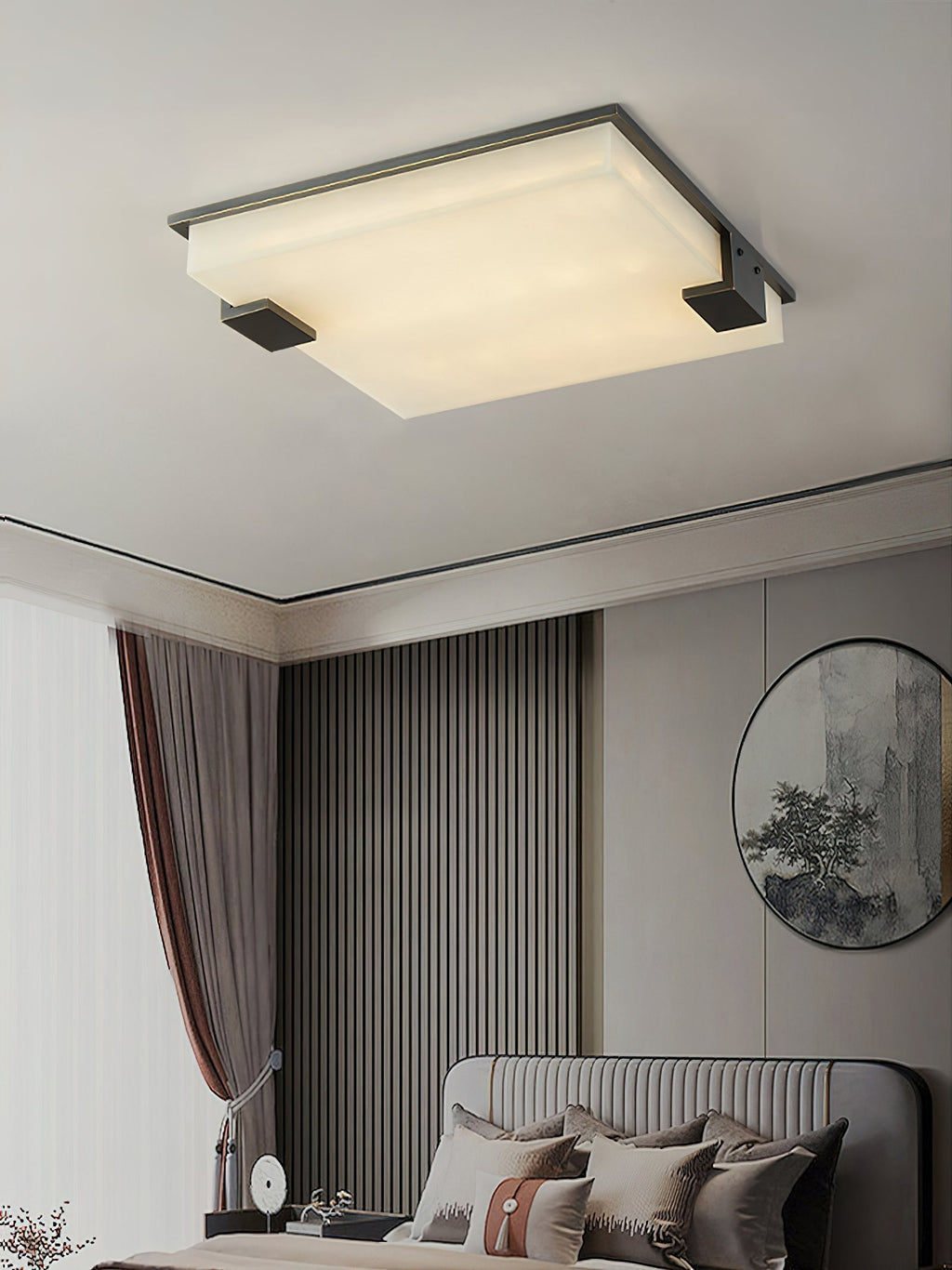 The Clérachic fixture over a bedroom with ribbed panelling, its warm square of light balancing the round wall mirror.