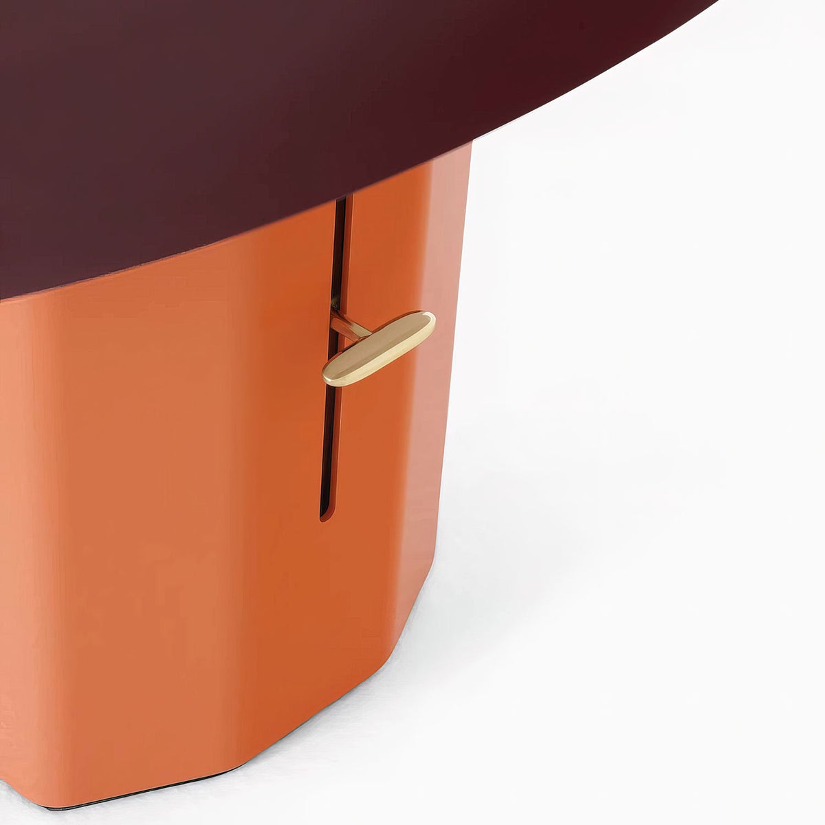 Close view of the slim brass switch lever set in the slot of the orange column on this Clérachic table lamp.