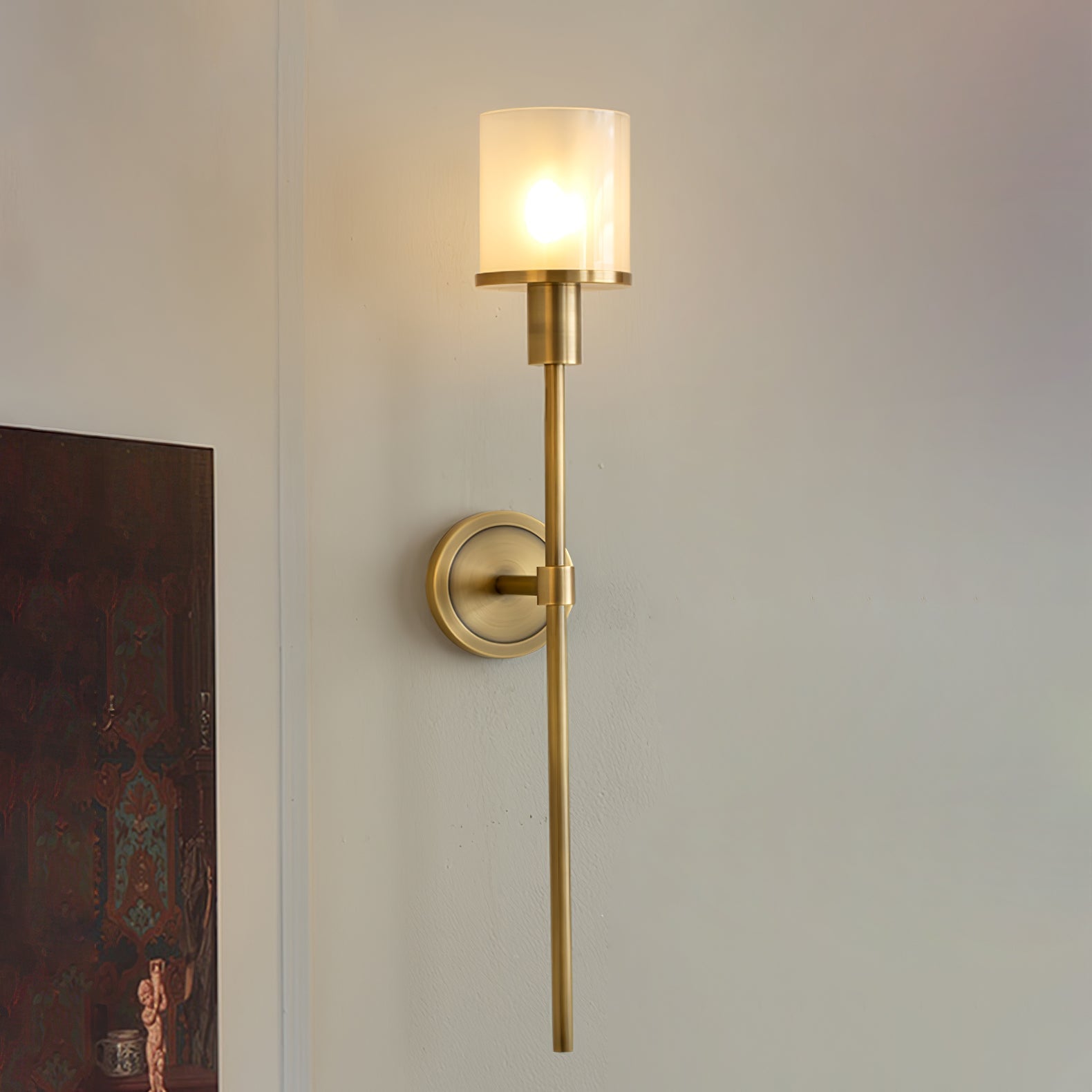 The Clérachic Mycara in copper, lit on a white corner wall beside the edge of a dark framed artwork.