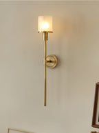 The Clérachic Mycara in copper seen at an angle, its long tail stem running down past a leaning gilt frame.