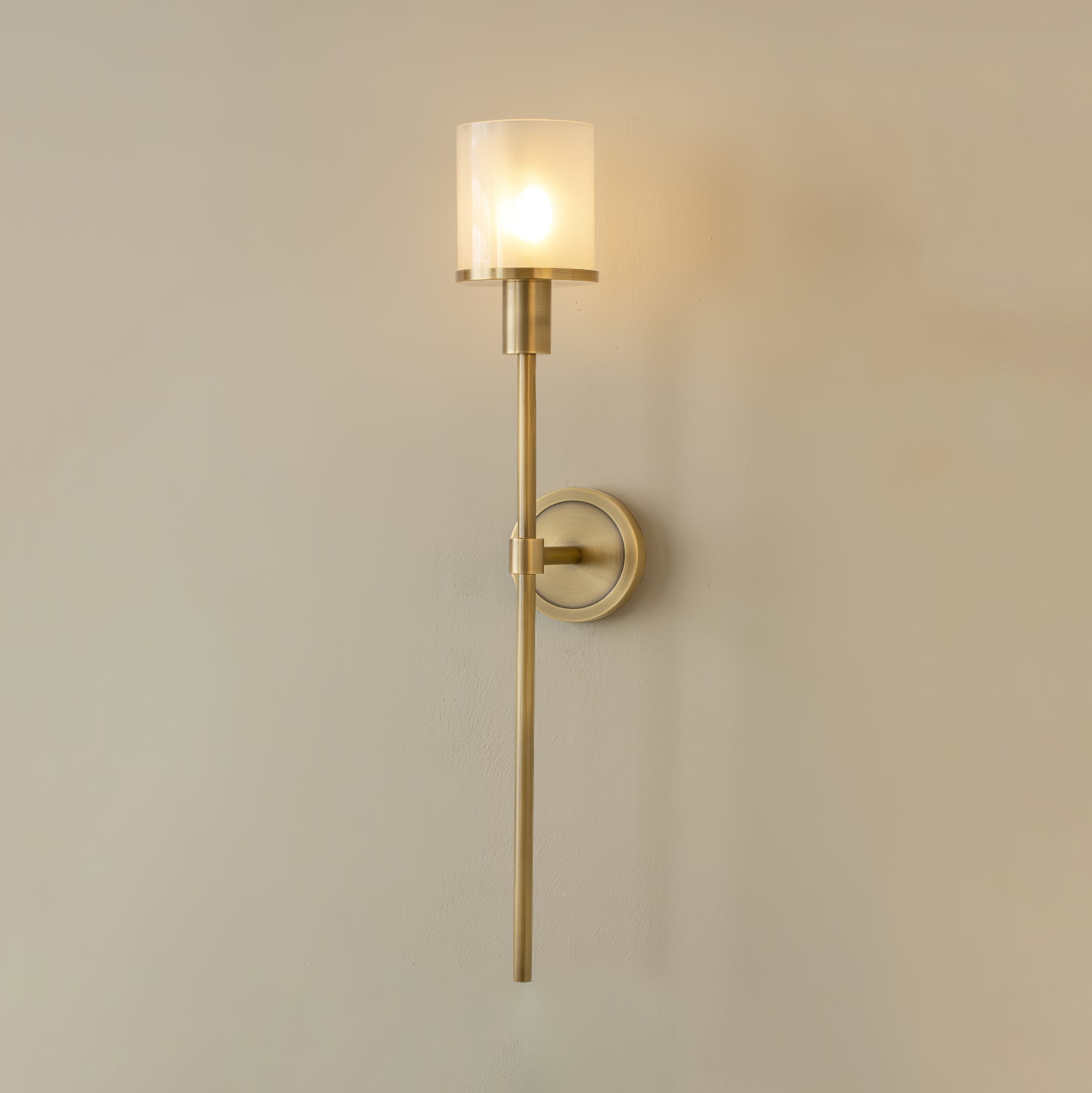 Clérachic Mycara sconce in copper shown straight on, so the full drop from shade to stem tip reads clearly.