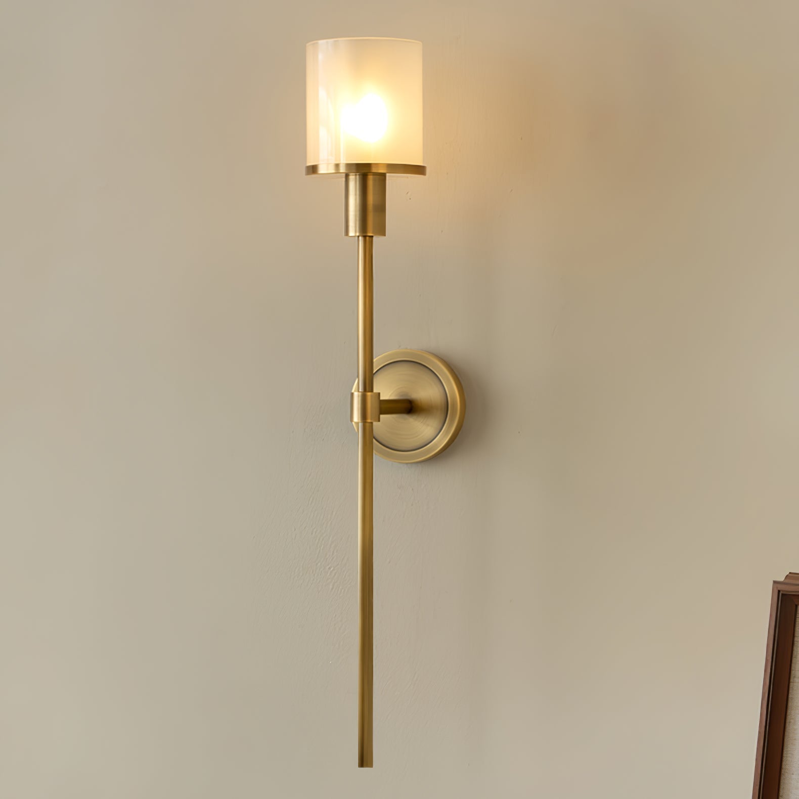 The Clérachic Mycara in copper, lit against a warm wall with a walnut frame edge just inside the right side.