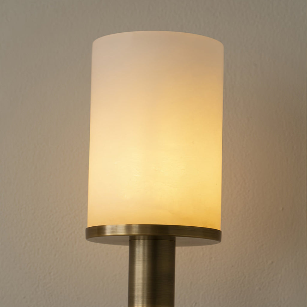 Clérachic alabaster shade on the Mycara sconce, lit so the stone grain shows above an antique copper collar.