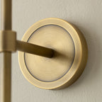 Close crop of the Clérachic Mycara's antique copper backplate, its brushed disc and arm meeting the wall.