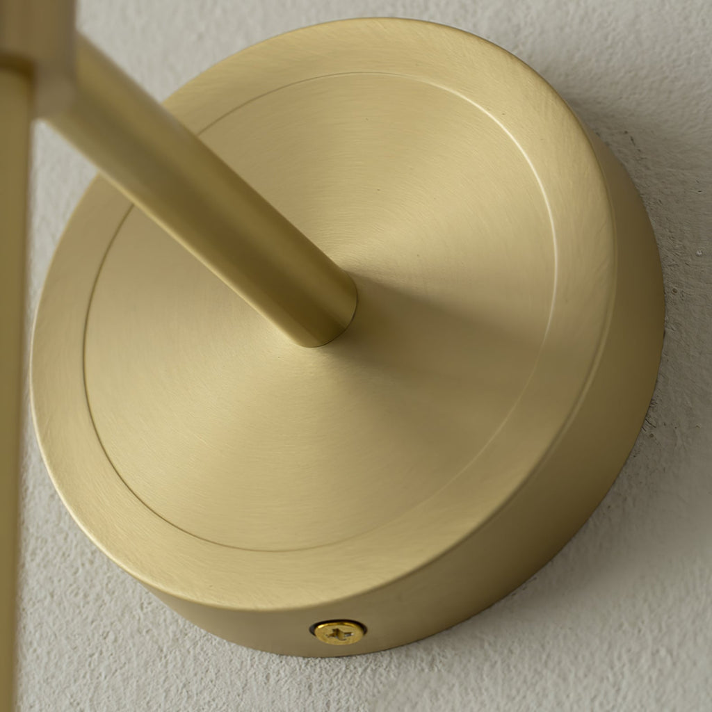 The Clérachic Mycara's polished copper backplate seen up close, the arm angling out from the turned disc.