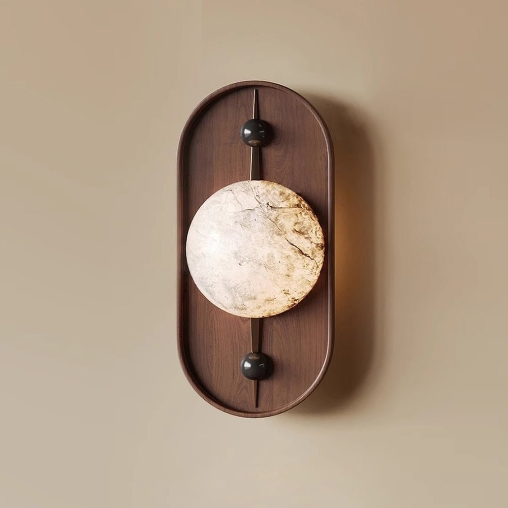 The Clérachic orb in close view, genuine alabaster with grey and gold seams running through the polished stone.