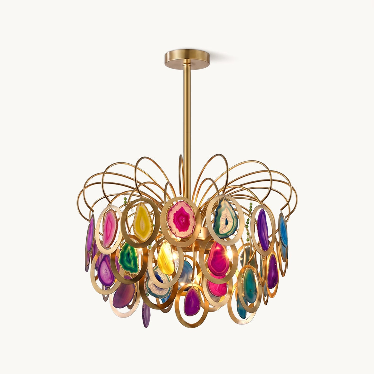 Clérachic agate chandelier in gold and multicolour, with looping brass wires and sliced agate discs in gold rings, on a plain white backdrop.