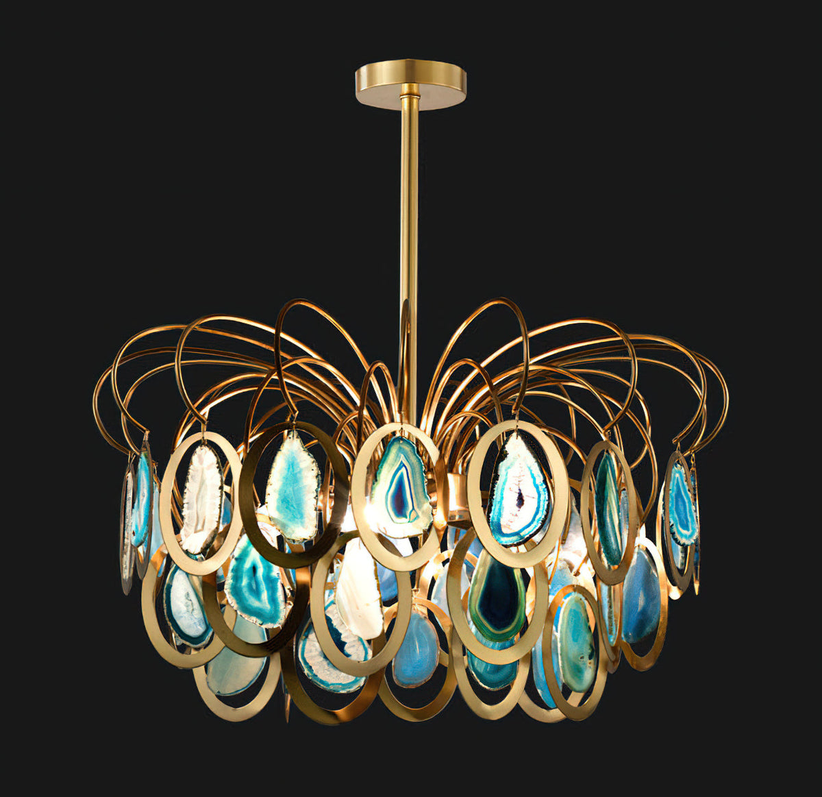 Blue agate Clérachic chandelier on a black backdrop, the glowing teal slices set in polished gold rings under looping brass wires.