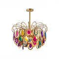 The multicolour Clérachic chandelier on white, with pink, yellow, green, purple and blue agate slices in gold rings.