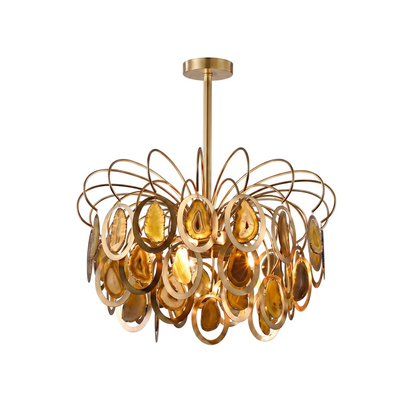 The yellow Clérachic agate chandelier on white, with honey and amber agate slices set in gold rings below looping brass wires.