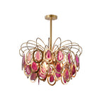 The pink version of this Clérachic agate chandelier on white, with rose and blush agate slices in gold rings.