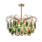 Closer view of the green Clérachic agate chandelier, its emerald and jade slices set in polished gold rings, on white.