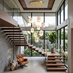 A tall stairwell with a cluster of Clérachic alabaster pendants hanging from a round gold canopy beside a floating timber staircase.