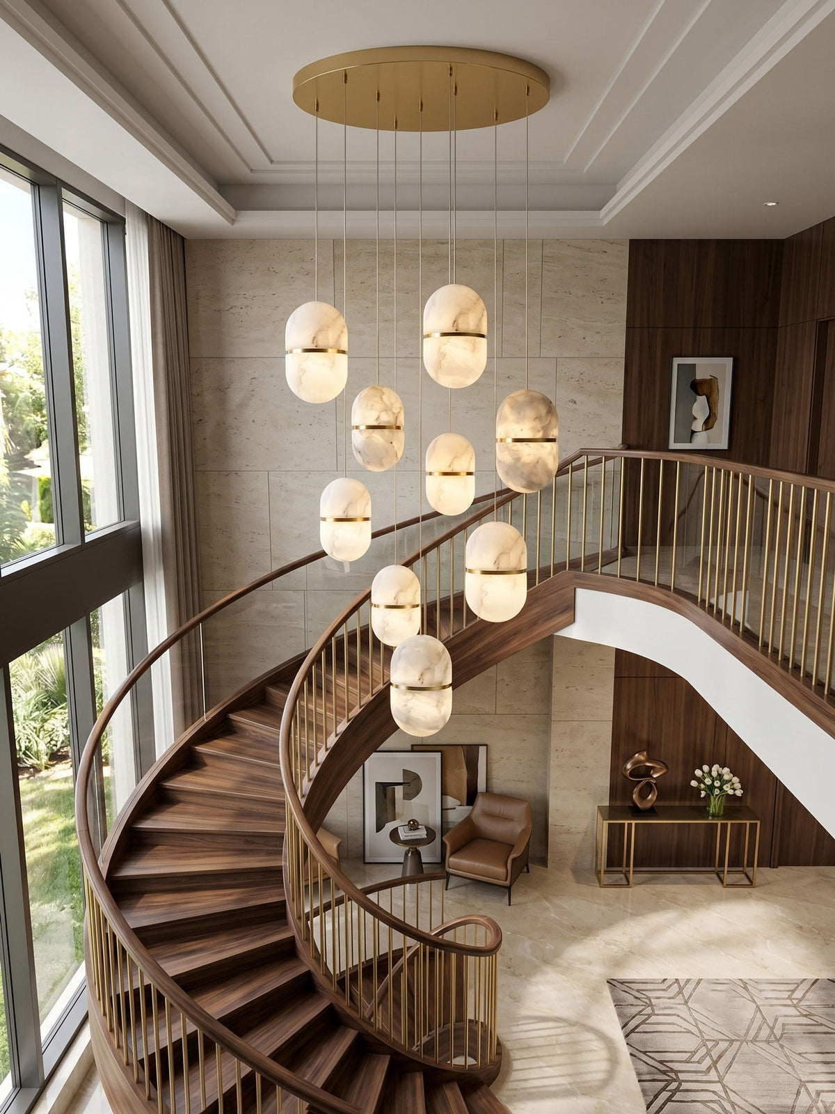 Seen from above, a cascade of Clérachic alabaster pendants hung from a round gold canopy beside a spiral staircase and tall windows.