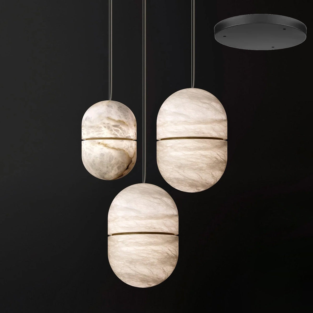 Three Clérachic alabaster pendants on a dark backdrop with a black round canopy at the top right, each with a dark band.