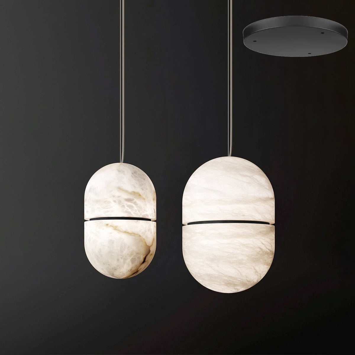 Two Clérachic alabaster pendants with dark bands beside each other on a dark backdrop, with a black canopy shown top right.