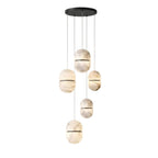 A Clérachic alabaster cluster of five pendants with dark bands, hung from a small black canopy on a white backdrop.
