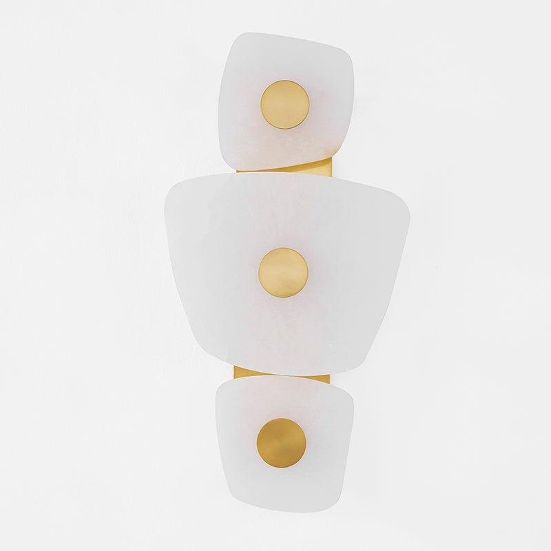 Clérachic natural alabaster wall sconce shown straight on and unlit, brass discs centred on each stacked stone plate.