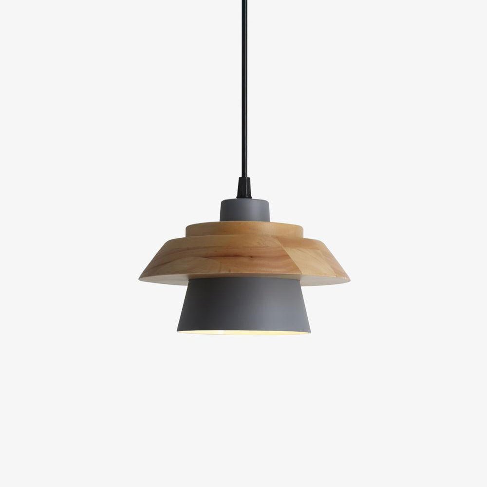 Grey metal shade under a layered natural wood top, hung from a black cord on a plain off-white backdrop, from Clérachic.