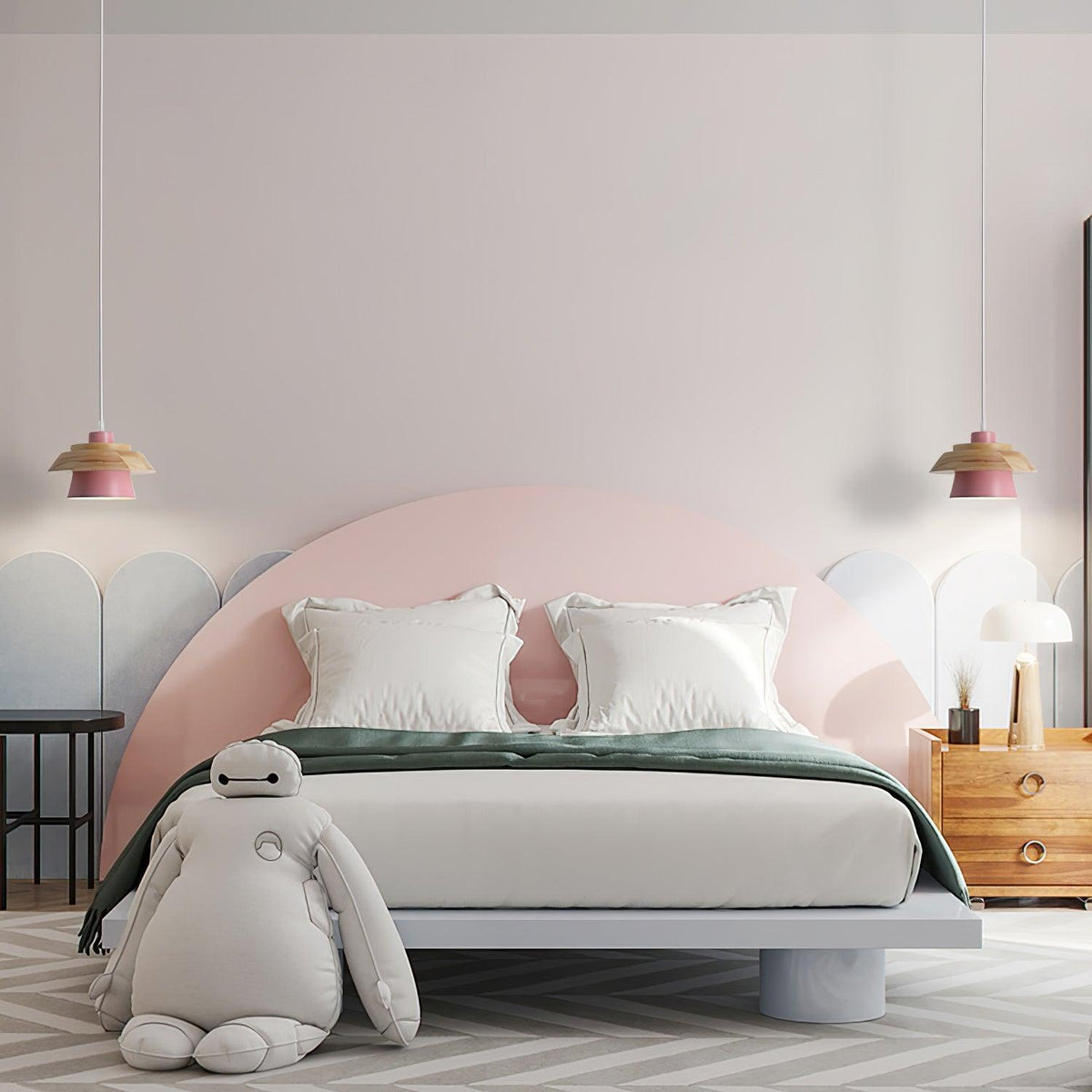 Two pink-shaded Clérachic pendants flank a pink arched headboard in a child-friendly bedroom with a large soft toy.