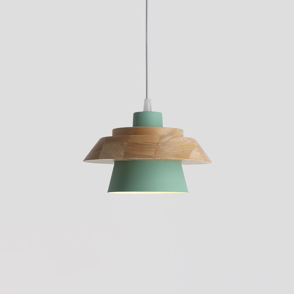 Green metal shade under a layered natural wood top and a white cord, on a plain pale grey backdrop, from Clérachic.