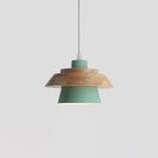 Green metal shade under a layered natural wood top and a white cord, on a plain pale grey backdrop, from Clérachic.