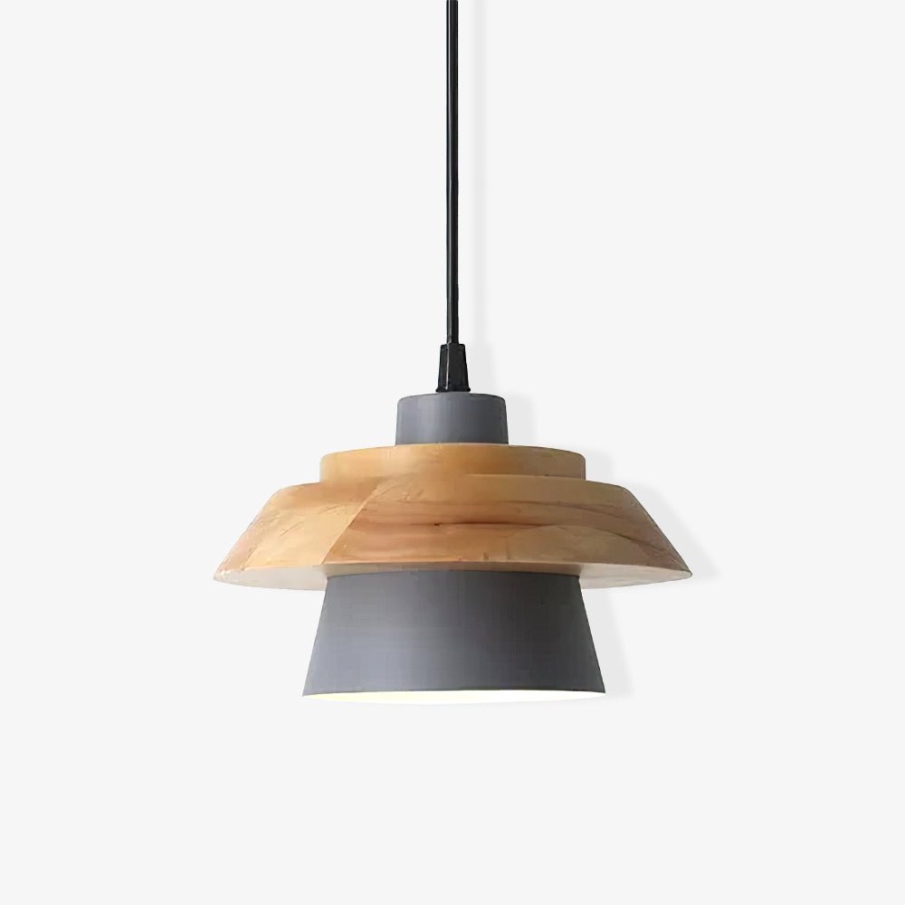 Close view of a grey-shaded Clérachic pendant, its layered wood top and black cord above a pale grey shade.
