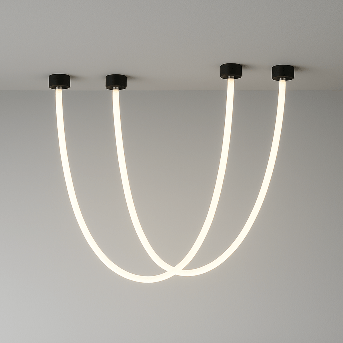 Clérachic black-capped flexible LED chandelier loops in two glowing white arcs from a plaster ceiling corner.
