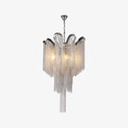 Unlit and tiered, this silver Clérachic chandelier is shown against a plain white backdrop.