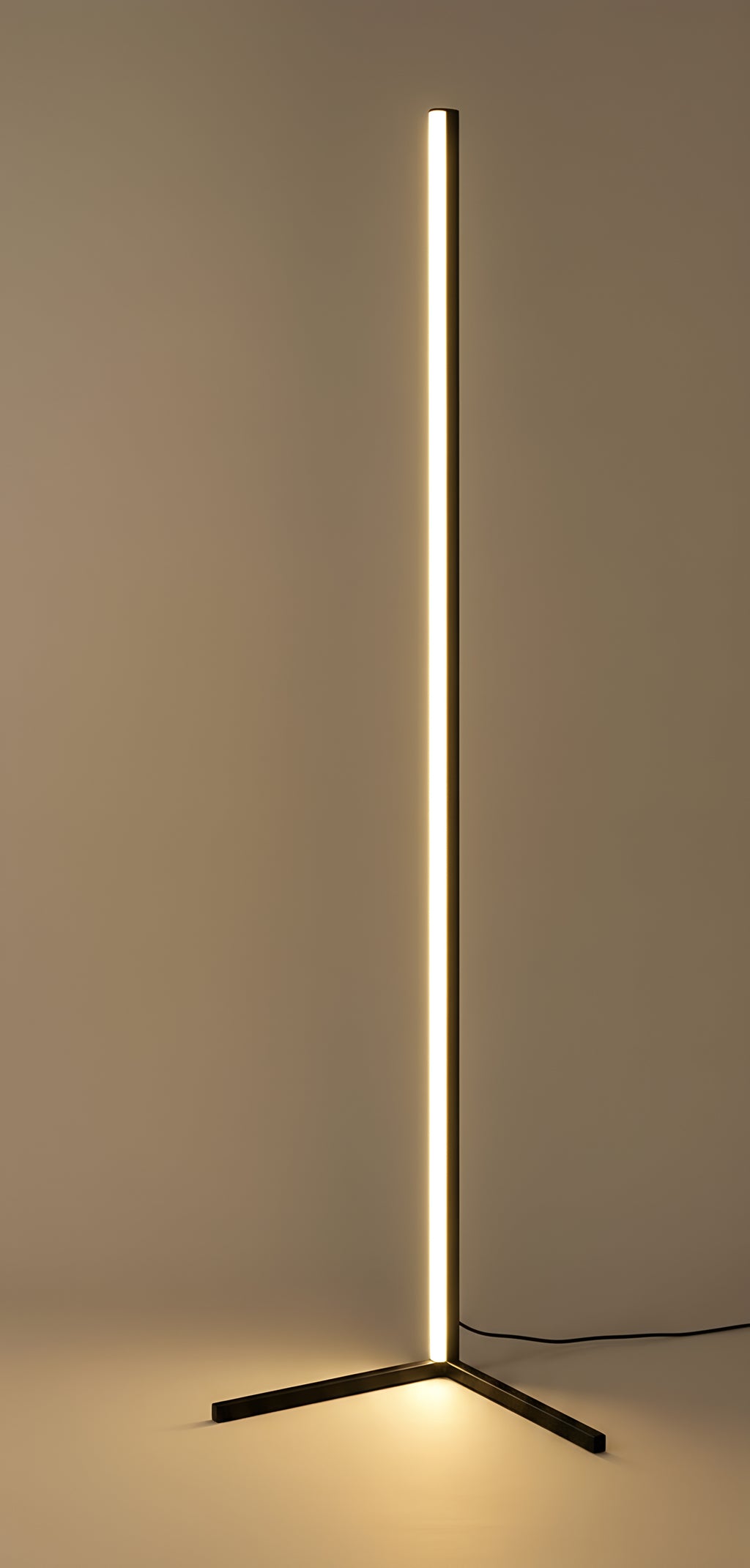 The same lamp turned towards the camera, one continuous seam of warm light running the full height of the bar