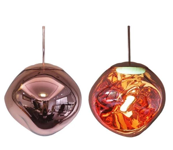 Clérachic melt-form glass pendant in copper, shown unlit and lit to reveal the molten interior.