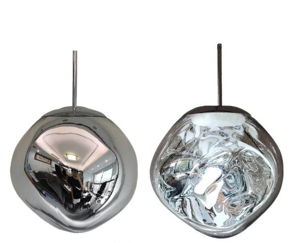 The Clérachic melt pendant in chrome, mirrored outside and rippled silver when lit.