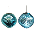 Clérachic melt pendant in blue, its mirrored shell turning translucent teal when lit.